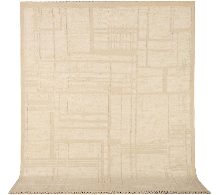 A relief-cut Moroccan carpet, c. 321 x 251 cm.