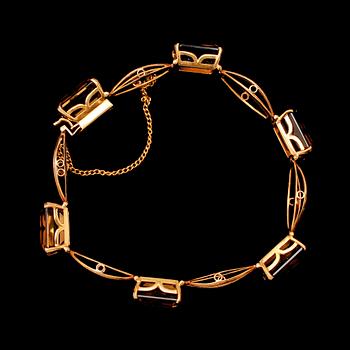 ARMBAND, guld, med röktopaser. Tot vikt 20 g.