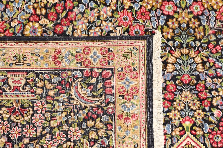 A Kerman Laver carpet, 'Millefleur', c. 392 x 300 cm.