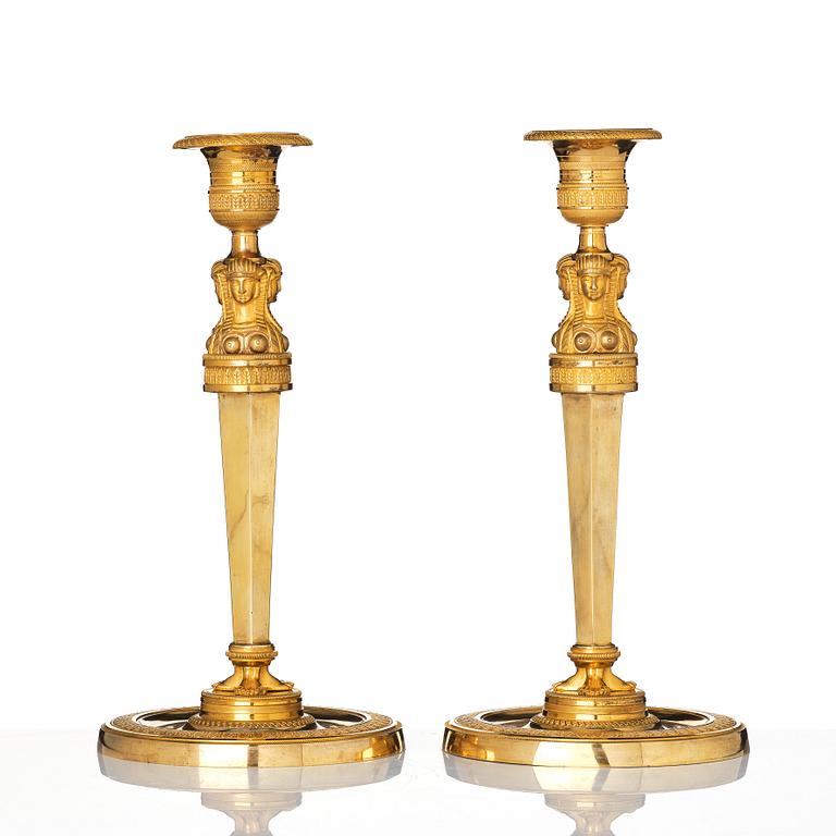 A pair of French Empire candlesticks, early 19th century.