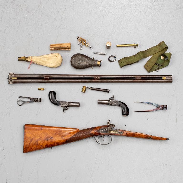 A cased double barreled percussion shotgun marked Gosset a Paris and a pair of percussion pistols marked Fni PAR LEPAGE.