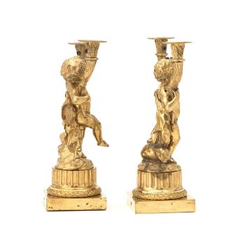 A pair of Louis XVI-style 19th century gilt bronze two-light candelabra.