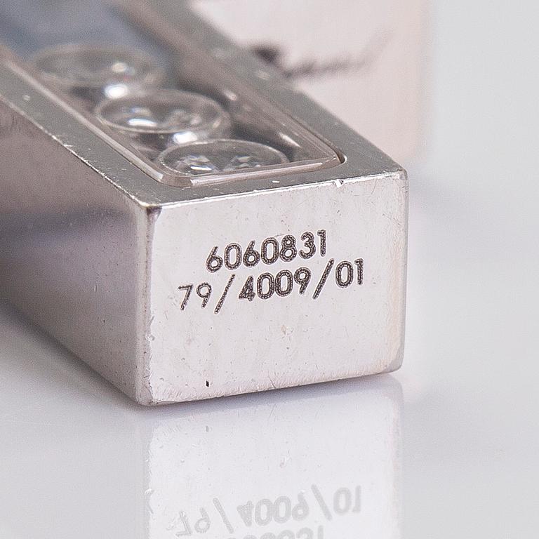 Chopard, an 18K whitegold 'Happy Diamonds" cross necklace set with diamonds.