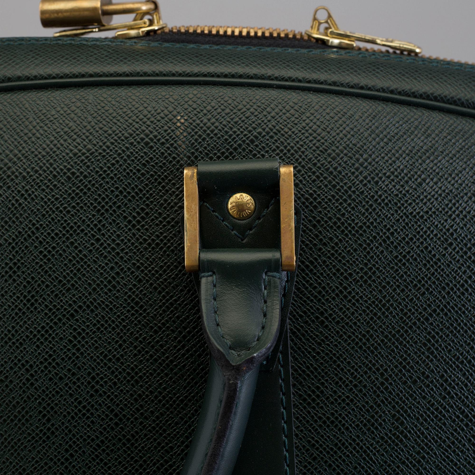 LOUIS VUITTON, a taiga leather 'Helanga' weekend bag.