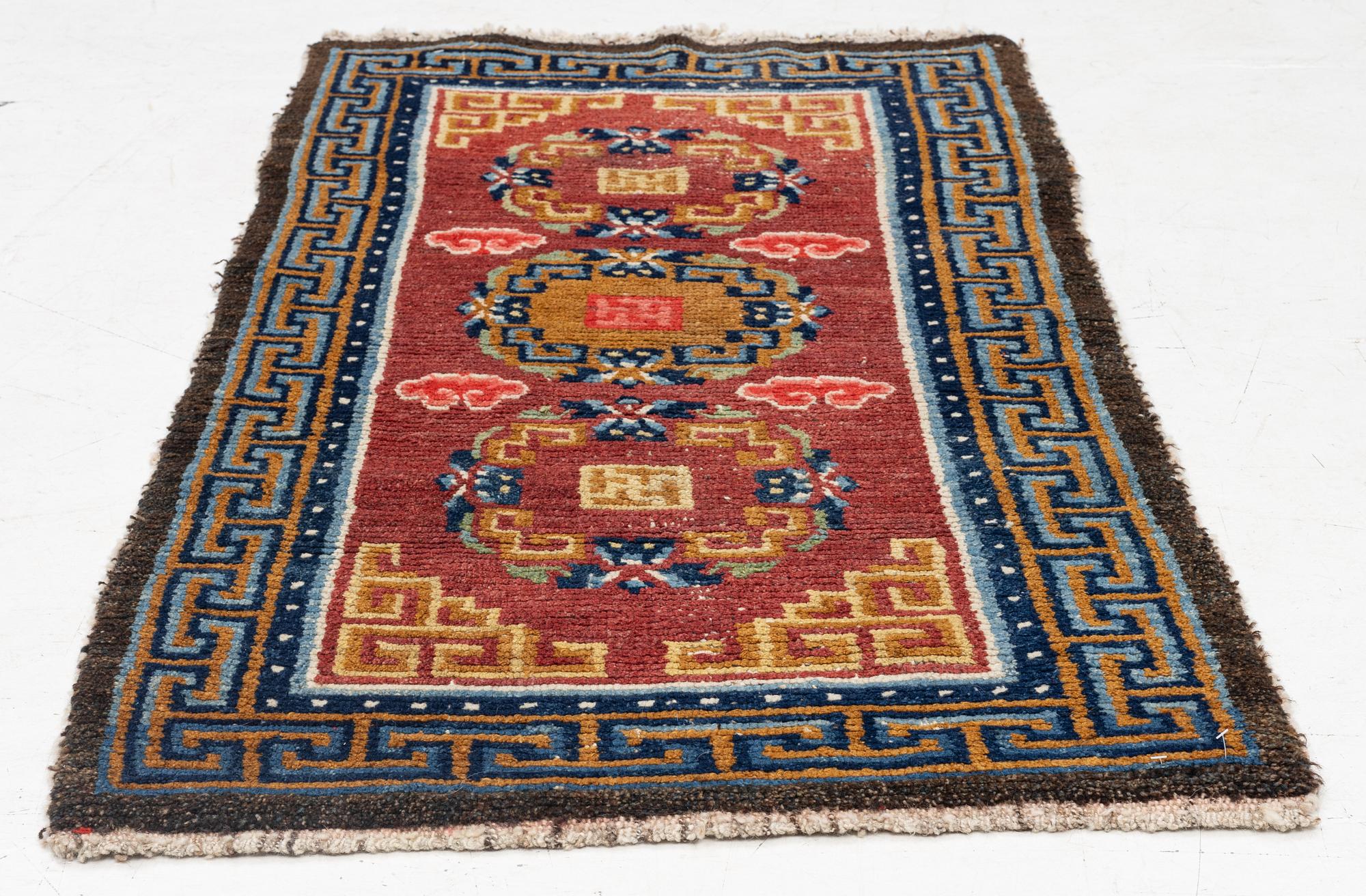 An antique Tibet 'Khaden' rug, c 135 x 70 cm.