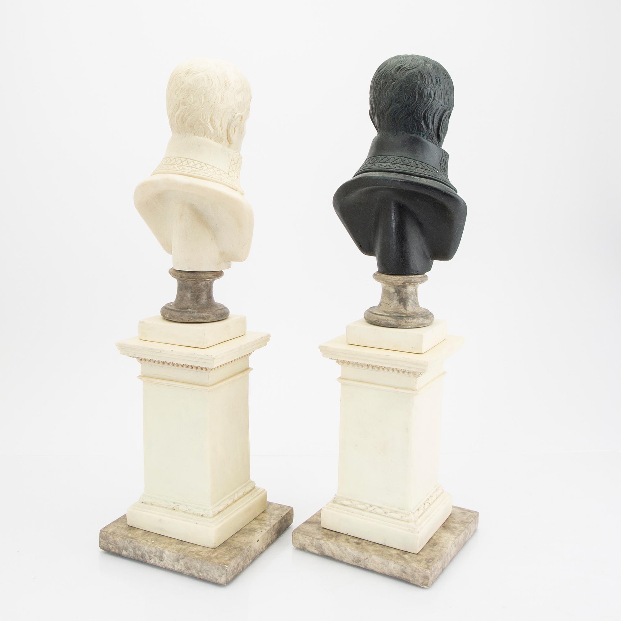 A pair of modern plaster statues of Napoleon.