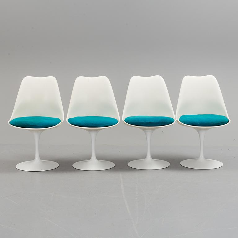 A "Tulip" table and four chairs by Eero Saarinen for Knoll International.