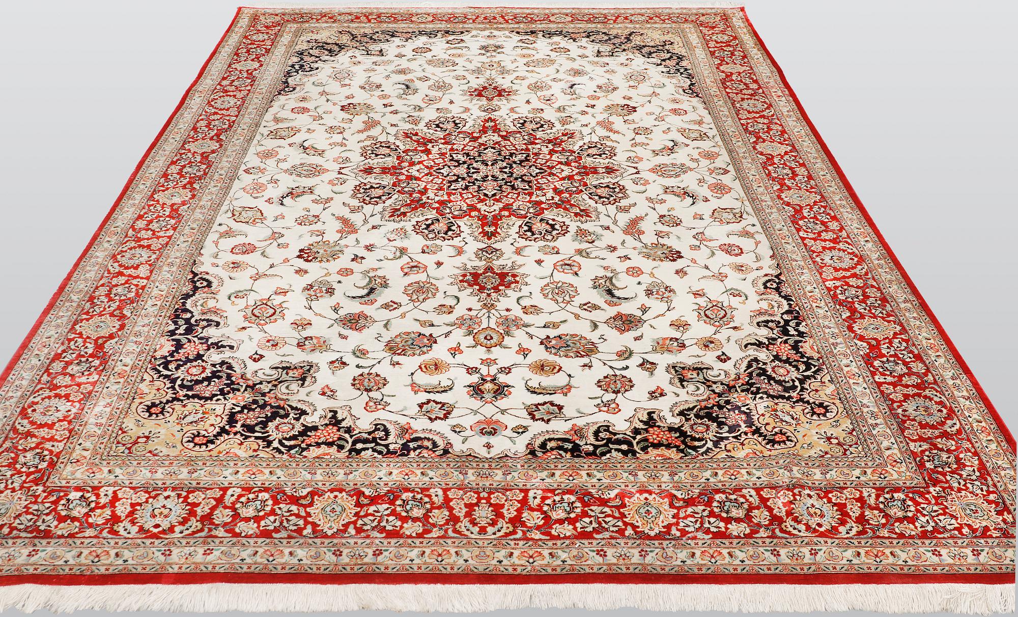 A silk Ghom carpet, 295 x 195 cm.