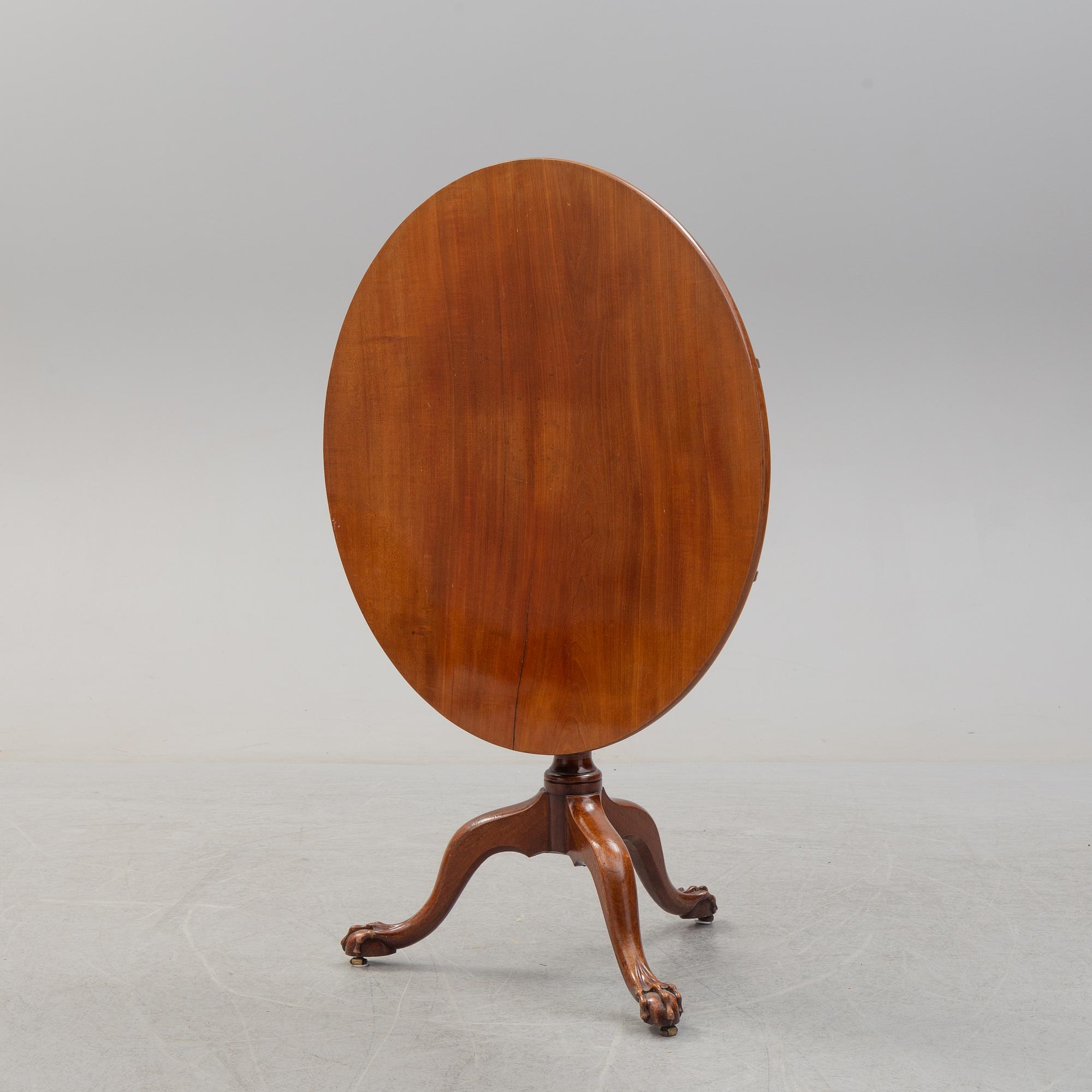 An 18th Century mahogany table.