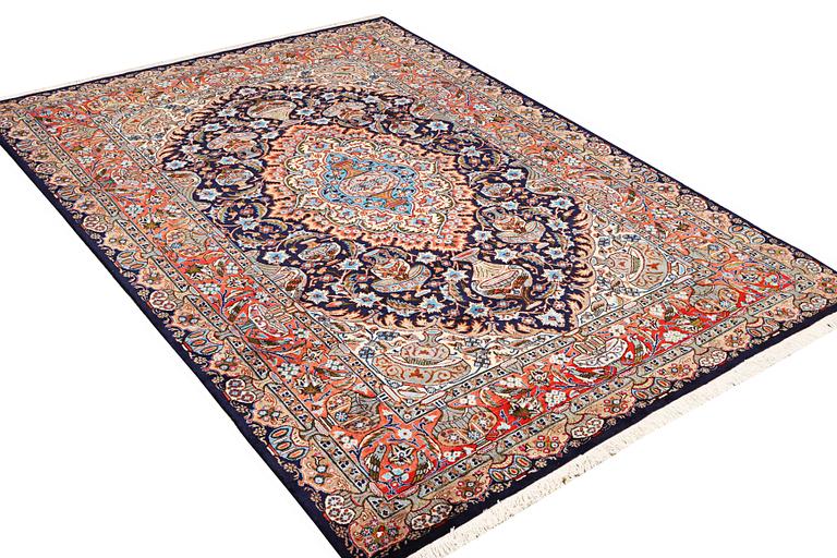 A Kashmar carpet, c. 310 x 203 cm.