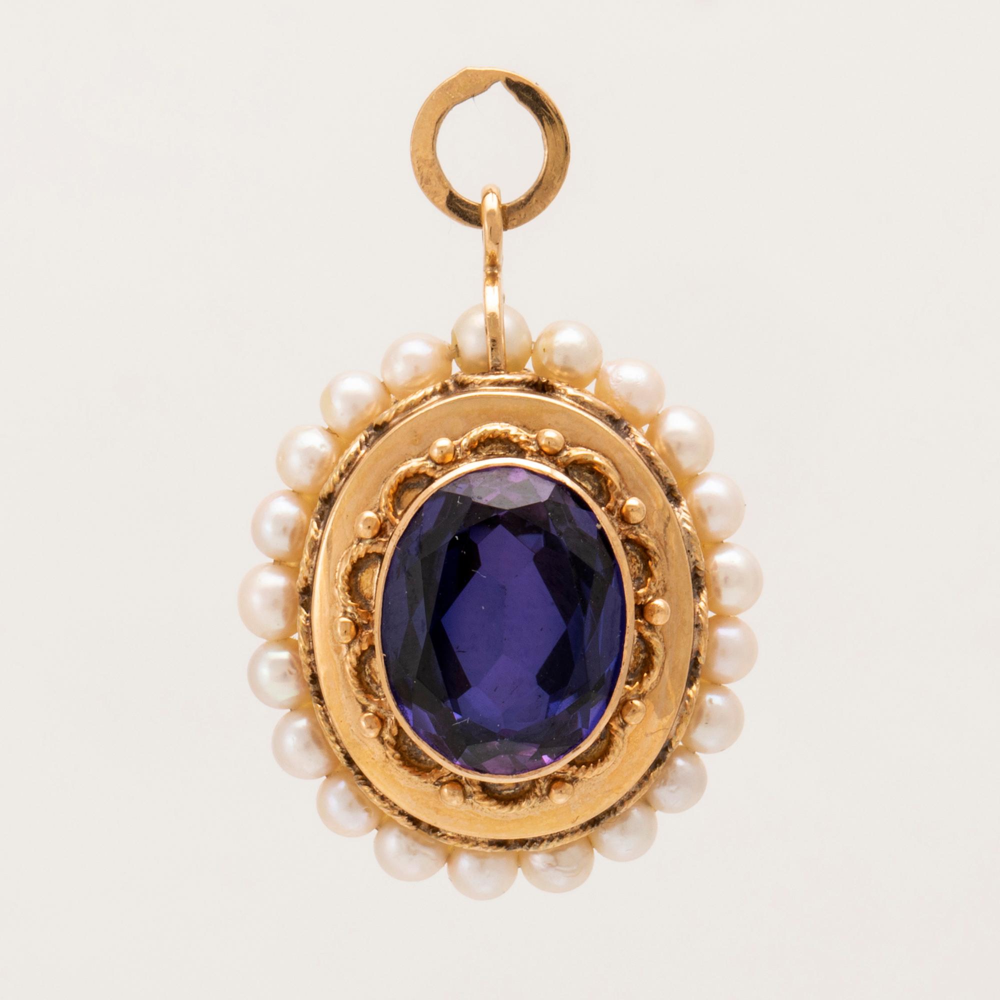 An 18K gold pendant set with synthetic colourchange purple sapphires and cultured pearls.