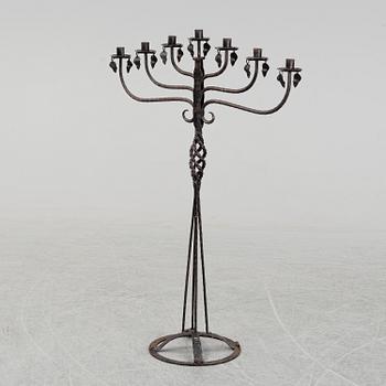 A wrought iron Swedish folk art candle holder.