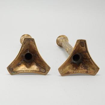 A pair of brass candlesticks from Elkingtons in Birmingham, 19th century.