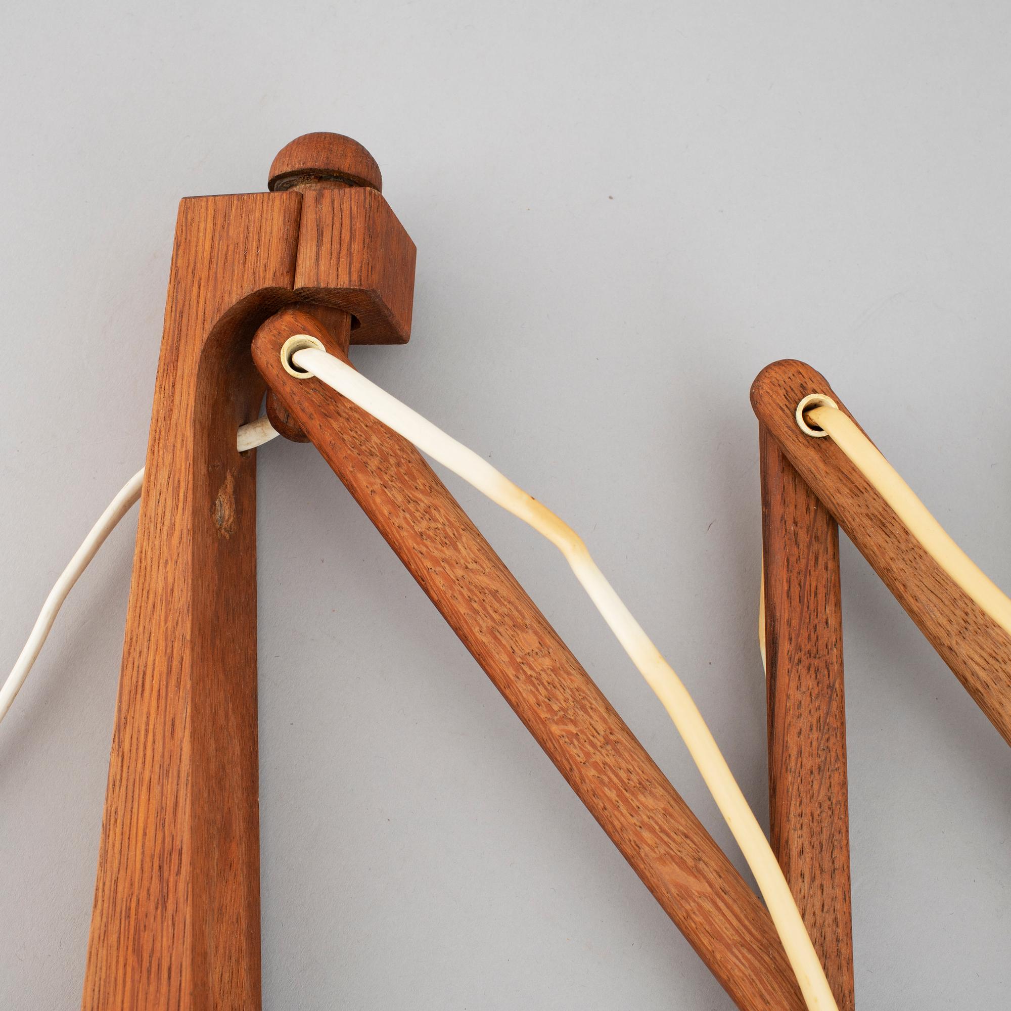 Two Le klint wooden wall lamps.