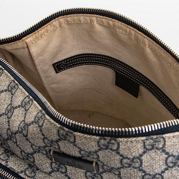 Gucci, A "GG Supreme messenger" bag.