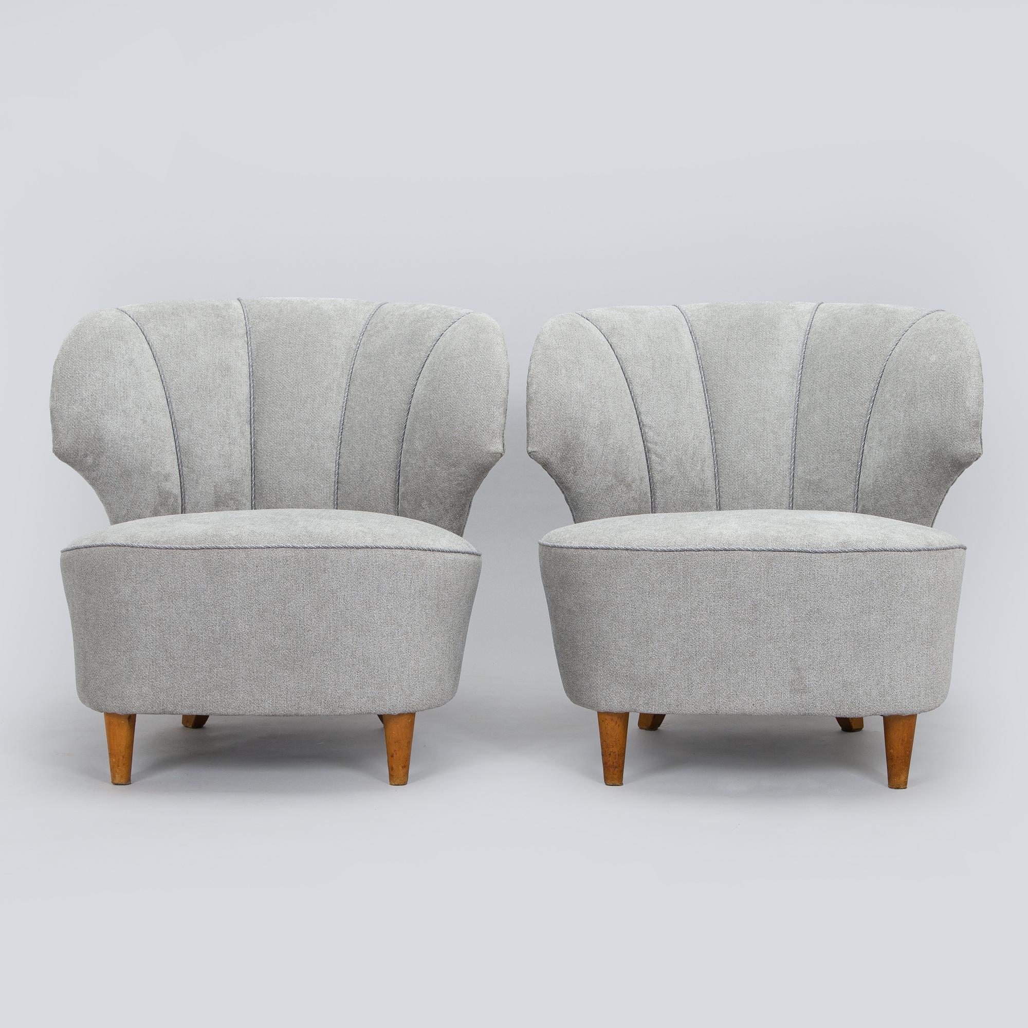 A pair of mid 20th century armchairs.