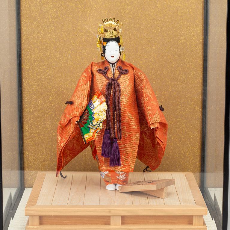 A Japanese doll from the 20th century.