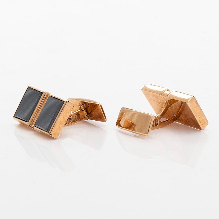 Kalvosinnapit, 14K kultaa ja hematiitit, Kaisaniemen Kello ja Kulta 1962.