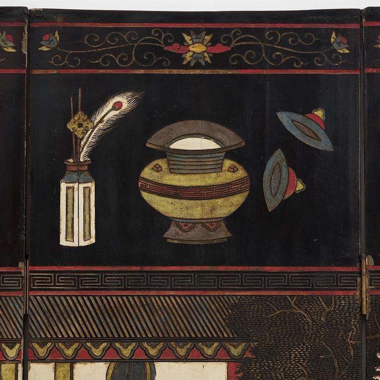 A Chinese four panel lacquer folding screen, first part of the 20th century.