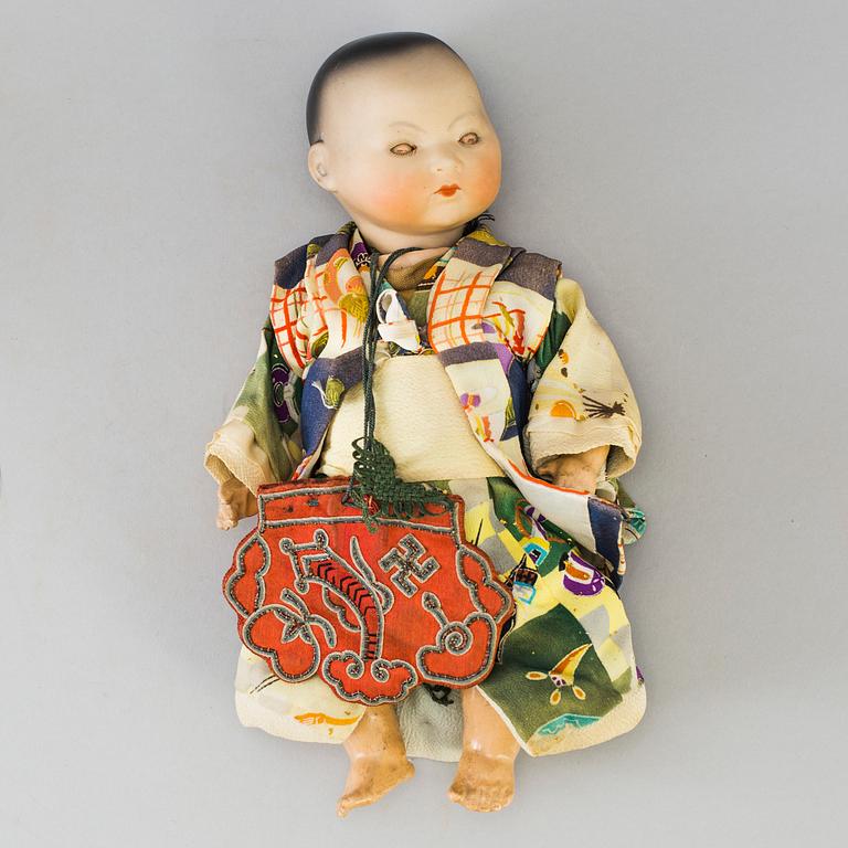 Two oriental bisque head baby dolls by Armand Marseille and Heubach Köppelsdorf, Germany, early 20th century.