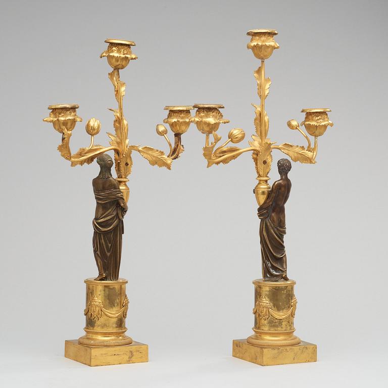 A pair of Louis XVI circa 1800 three-light candelabra.