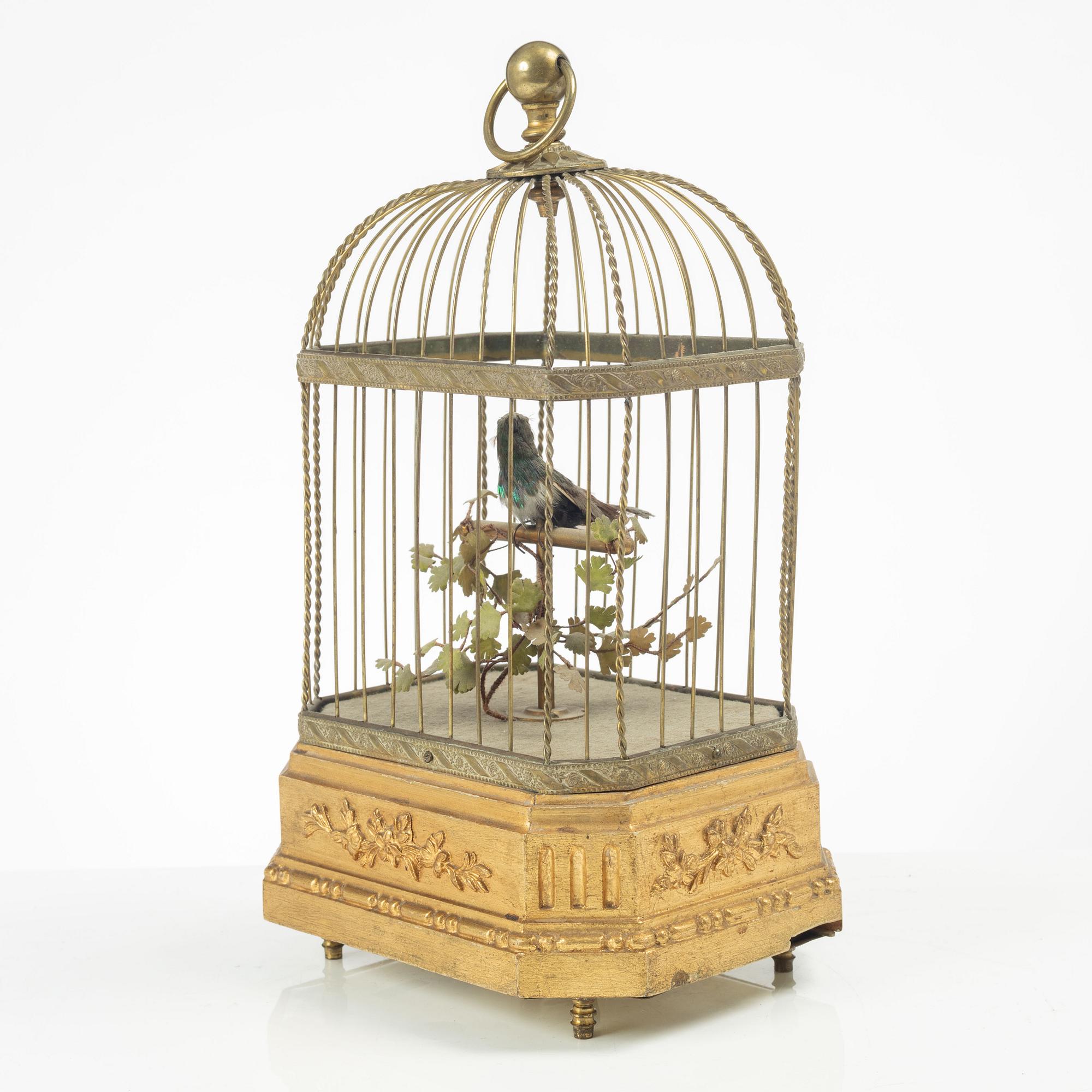 A music box in the shape of a bird's cage, France, late 19th century.