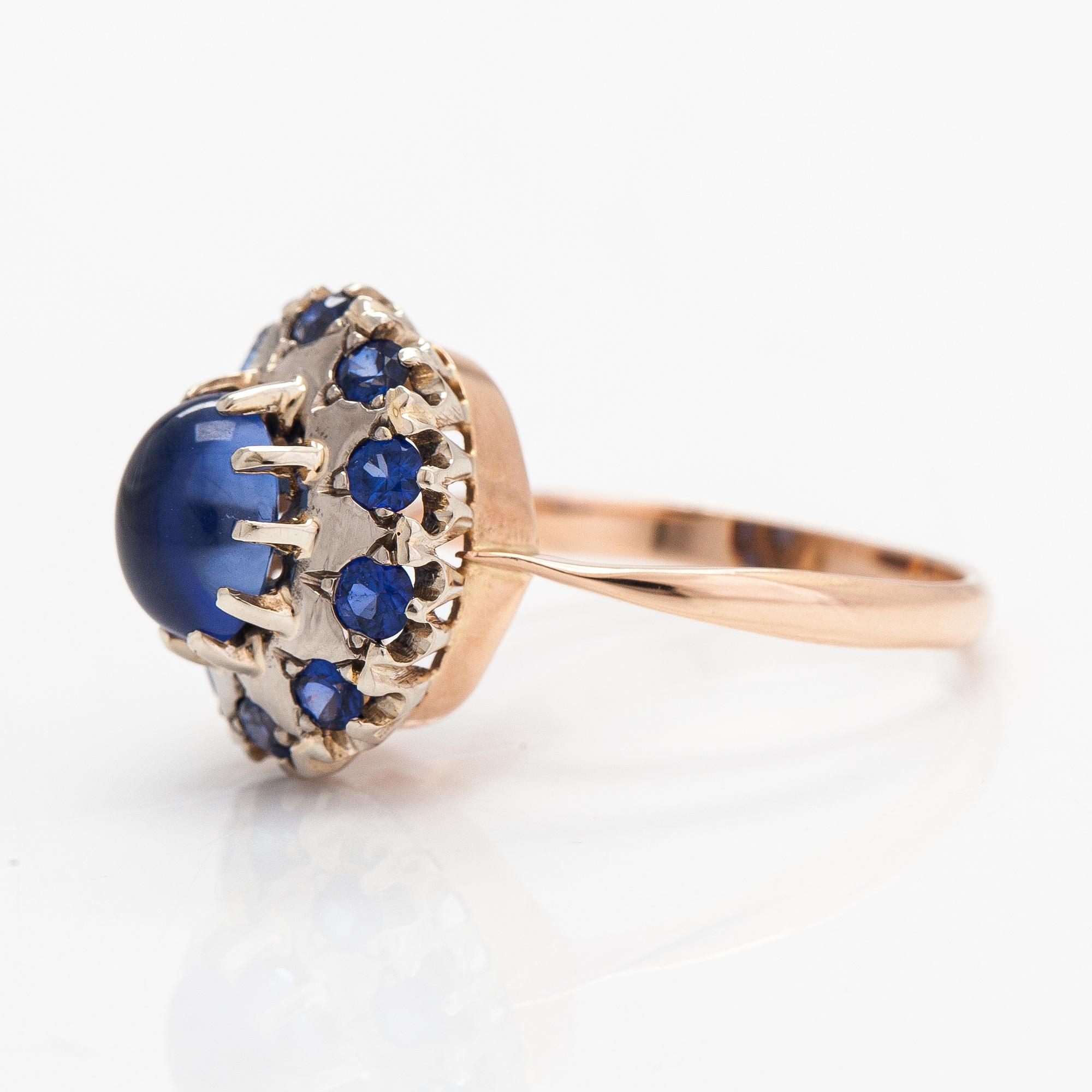 A 14K gold ring with a cabochon-cut synthetic sapphire and real sapphires. Yerevan.