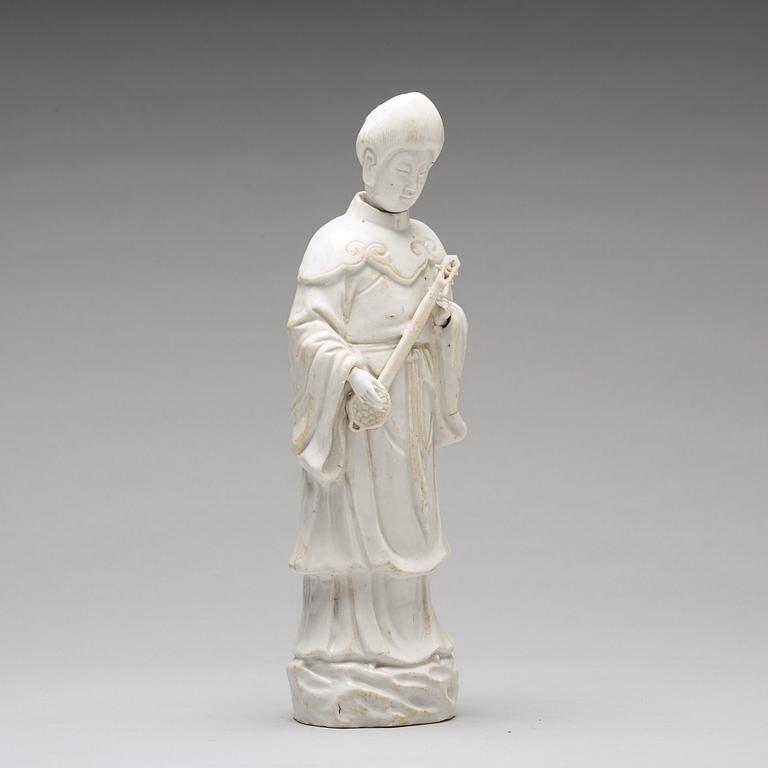 A blanc de chine figure of a lady-in-waiting, Qing dynasty, Kangxi (1662-1722).