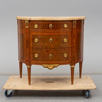 A Louis XVI-style 20th century commode.