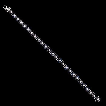 ARMBAND, 18 k vitguld, briljantslipade diamanter tot ca 1.21 ct, navettslipade safirer tot ca 11.16 ct.