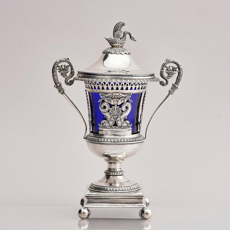 Lockurna, silver med blå glasinsats, Frankrike 1800-talets början.