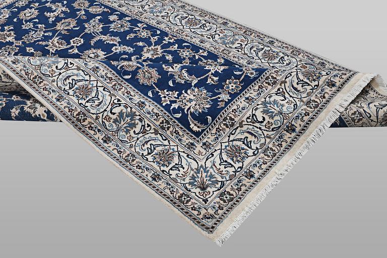 A carpet, Nain, part silk, ca 297 x 194 cm.