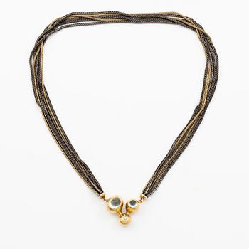 Ole Lynggard lås 18K guld med akvamariner och en rund briljantslipad diamant, design Charlotte Lynggard.