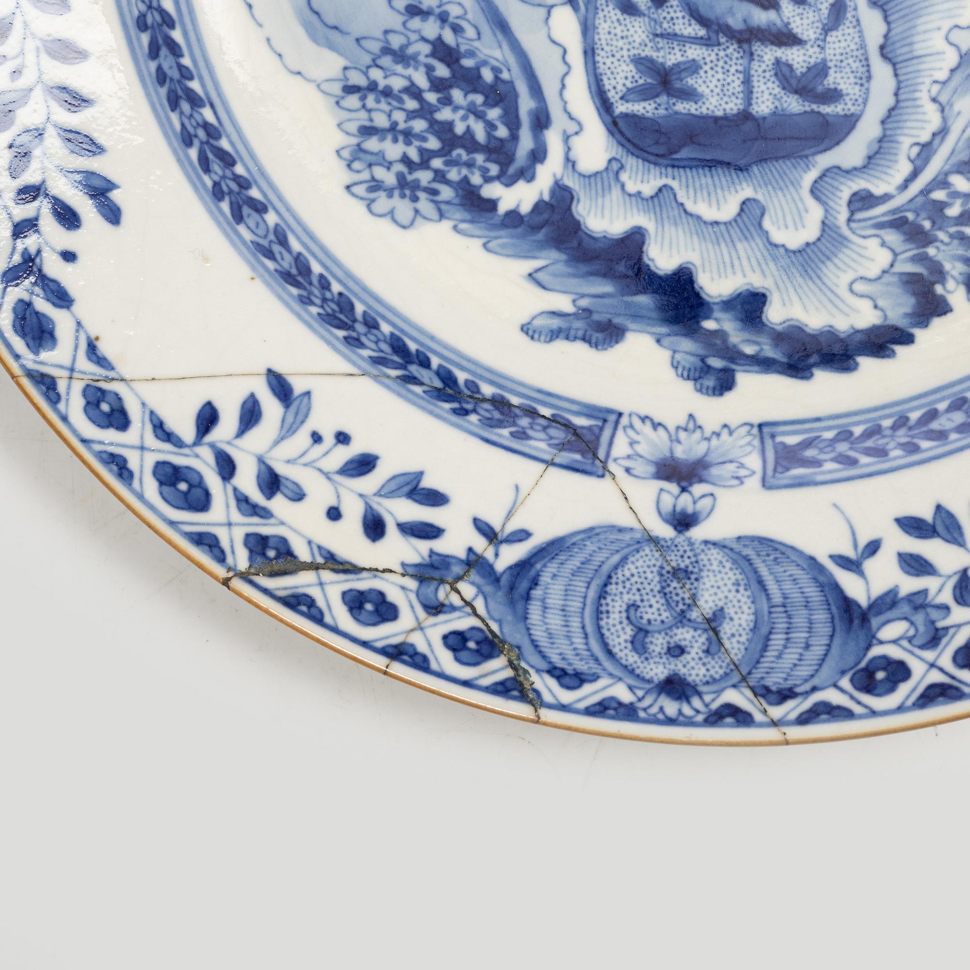 A pair of armorial dinner plates, soft paste, Qing dynasty, 18th century.