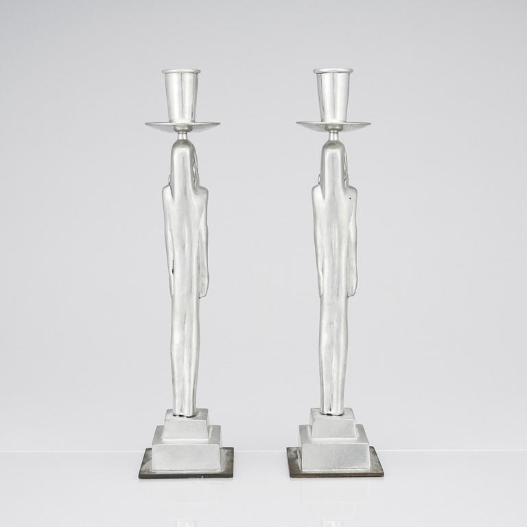 Edvin Öhrström, a pair of pewter and brass 'Egyptian' candlesticks, Svenskt Tenn, Sweden 1984.