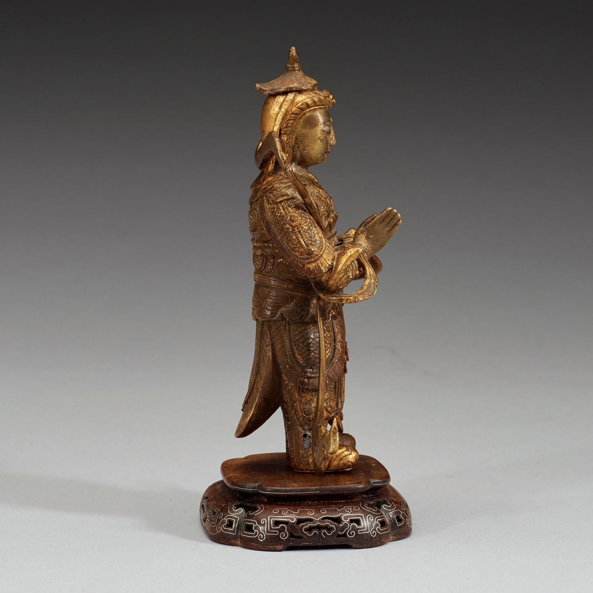 A gilt bronze figure of a Lokapala, Qing dynasty, 19th Century.