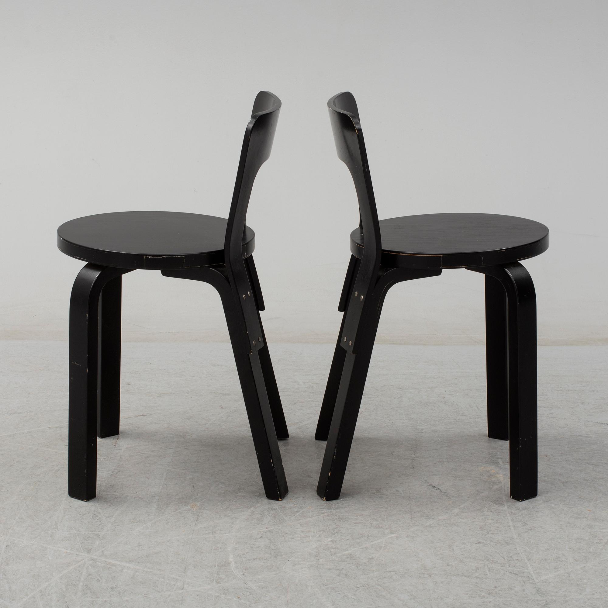 ALVAR AALTO, a pair of painted model 65 chairs from Artek, Finland.