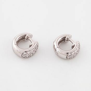 A pair of brilliant cut diamond earrings..
