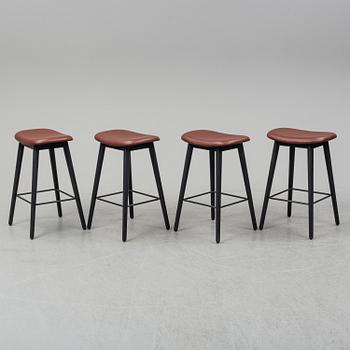Four contemporary leather upholstred stools by Berlin & Iskos for Muuto.