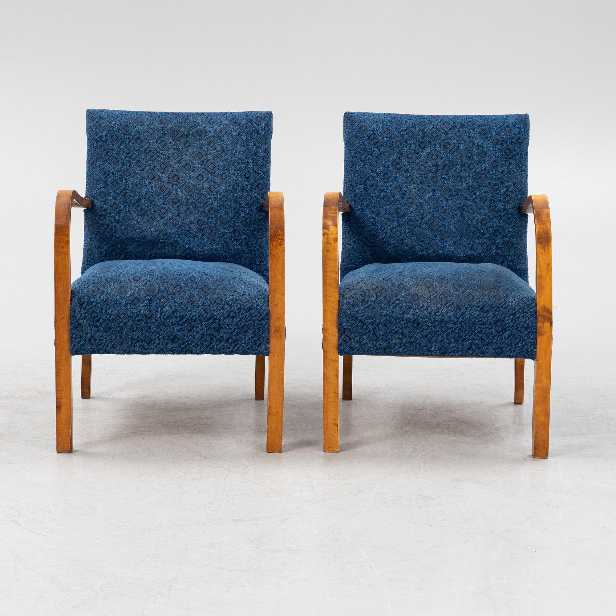 A a pair of stained birch armchairs 1930s-40s.