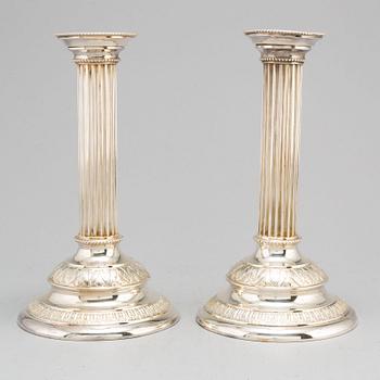 A pair of silver plated candle sticks.