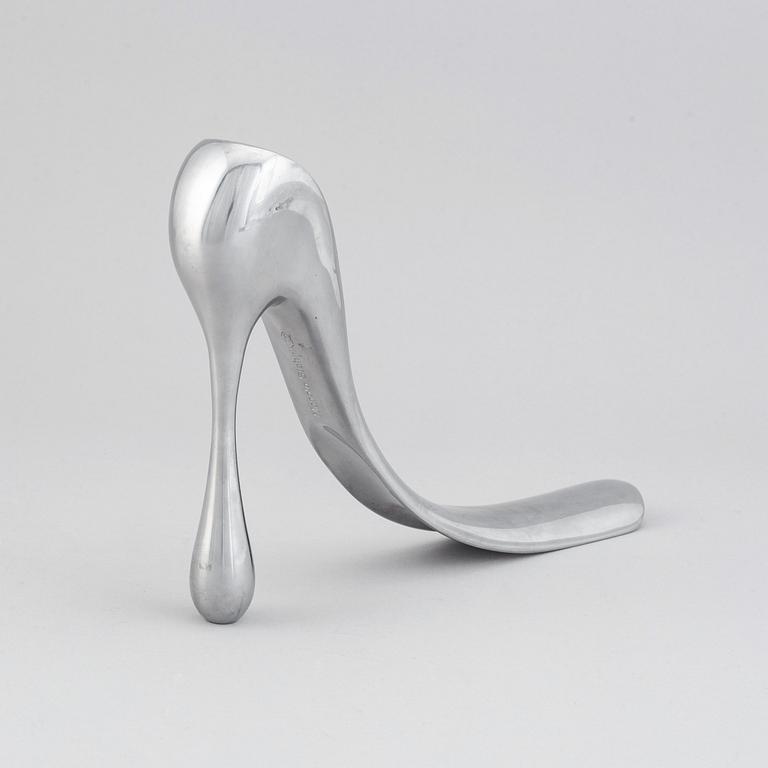 A metal shoe horn by Manolo Blahnik, 2000s.