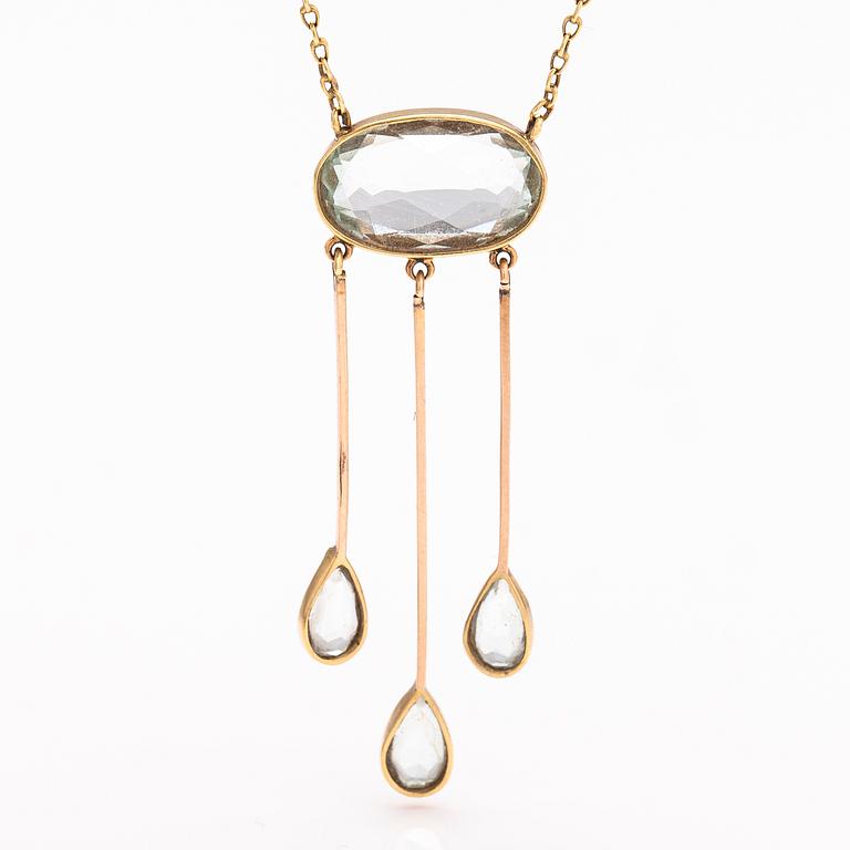 An 18K and 14K gold necklace with aquamarines.