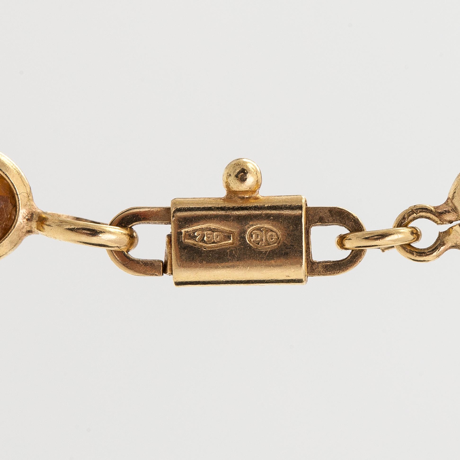 Halsband, 18K guld, med flerfärgade fasettslipade stenar.