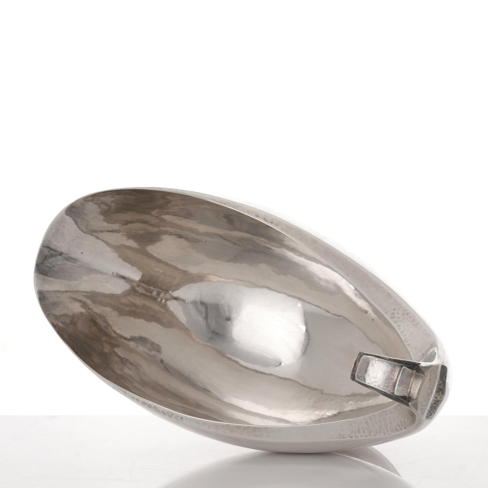 Georg Jensen, a sterling silver sauceboat and ladle, Copenhagen 1925-1945, design nr 98 and 141.
