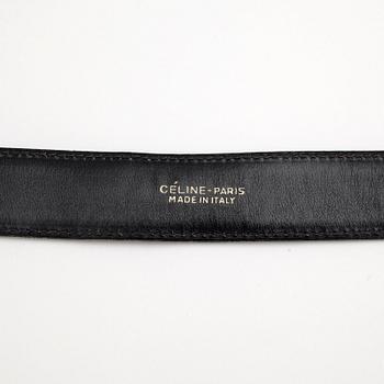 CÉLINE, a dark blue leather belt.