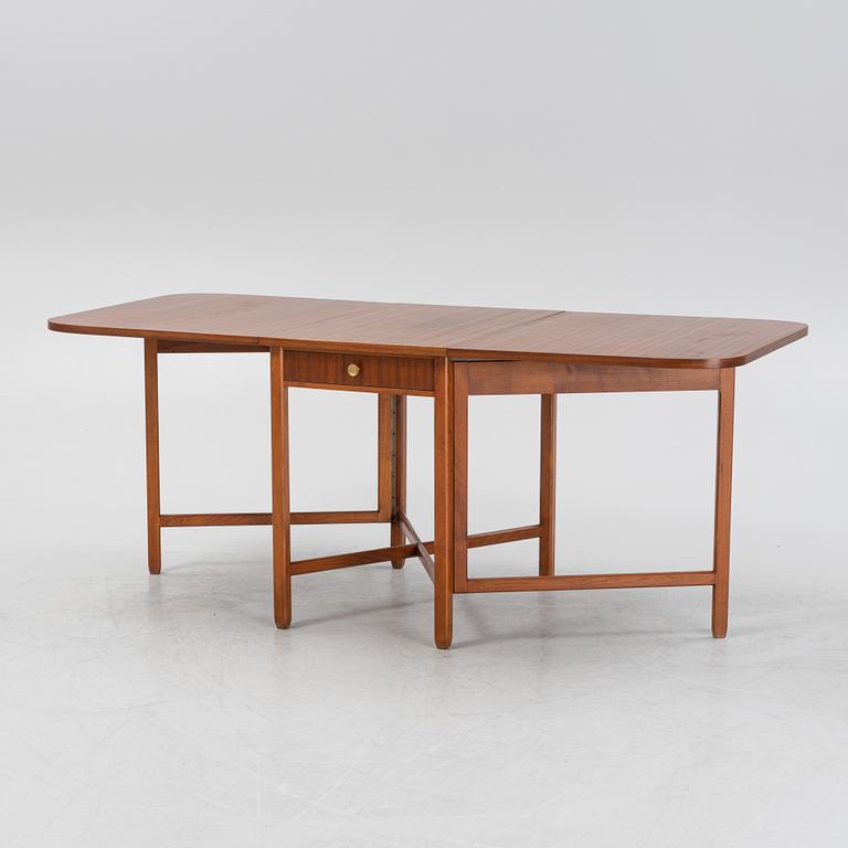 A mahogany veneered gate-leg table, second half of the 20th Century.