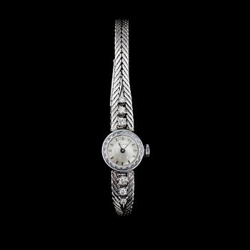 DAMARMBANDSUR, 18k vitguld med 6 briljantslipade dia, Juwel. 1970-tal. Tot.vikt 23g.