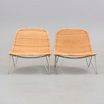 a pair of 21h Century lounge chairs designed by James Irvine, by IKEA.