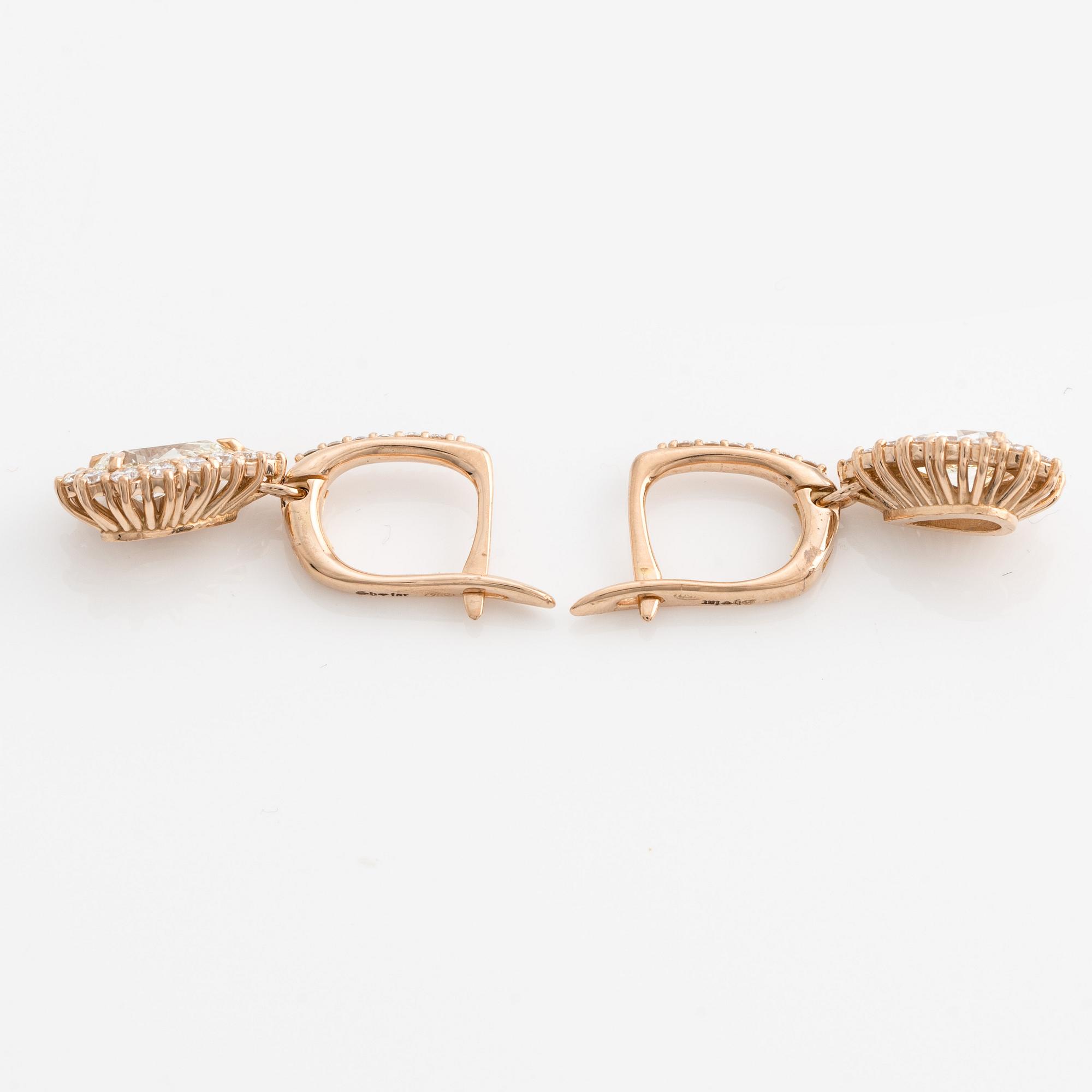 Earrings with drop-cut diamonds accompanied by brilliant-cut diamonds, including a GIA dossier.